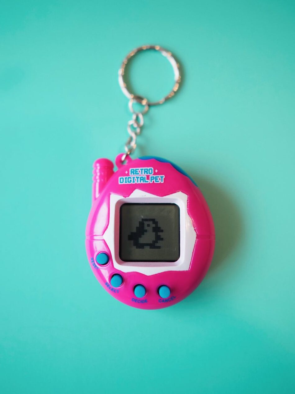 vibrant retro digital pet keychain on blue